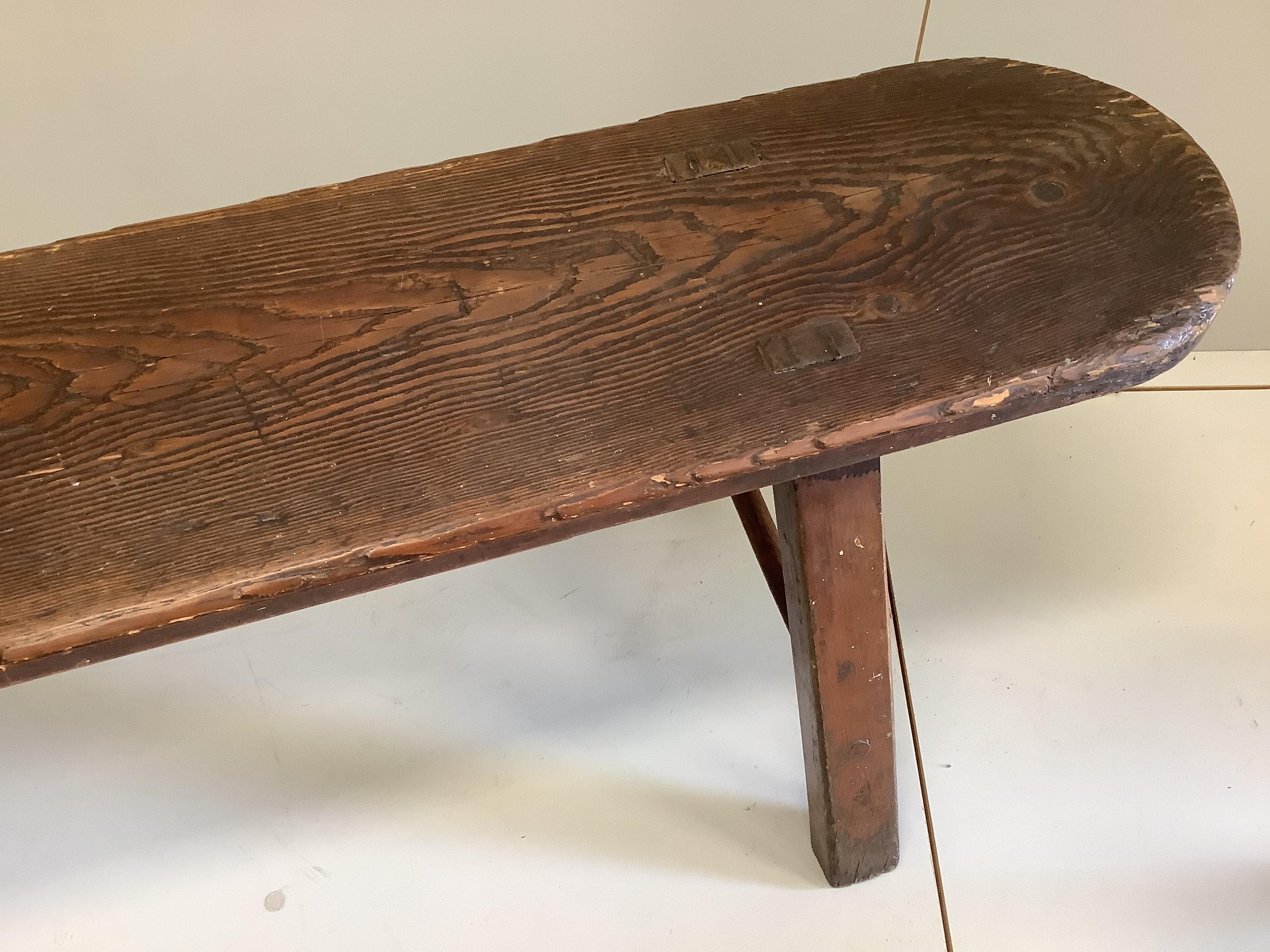 A 19th century pine and fruitwood bench and an elm hexagonal stool, bench length 172cm, height 46cm.